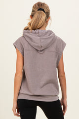 woman wearing a taupe sleeveless maternity hoodie with a hood, viewed from the back