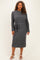 woman wearing a dark grey ribbed plus size knit dress with long sleeves and a tied waist detail