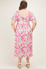 woman wearing a floral print maternity dress with short sleeves, showing the back view and a comfortable loose fit