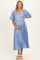 woman wearing a light blue floral maternity dress with puff sleeves and a visible baby bump