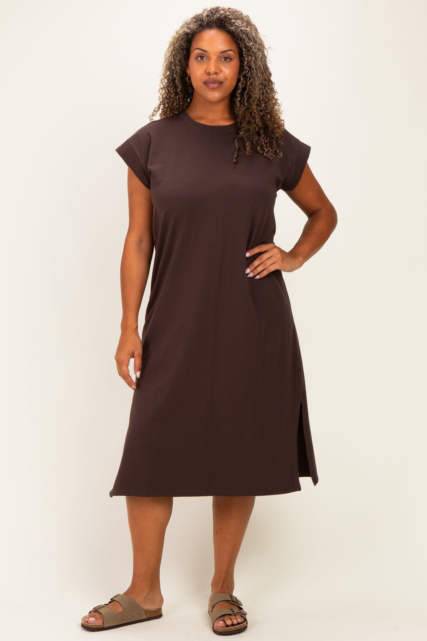 woman wearing a dark brown plus size t-shirt dress with cap sleeves and side slits