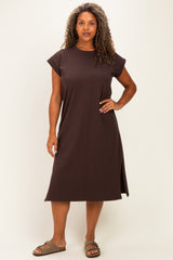 woman wearing a dark brown plus size t-shirt dress with cap sleeves and side slits