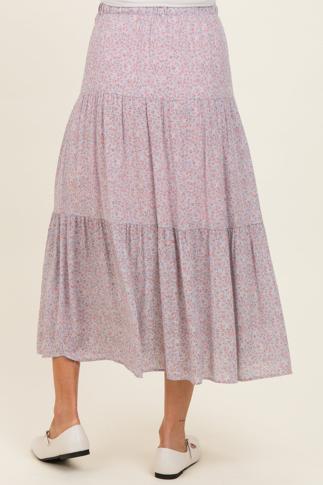 maternity wear floral tiered maxi skirt in pink and purple hues, model shown from the back