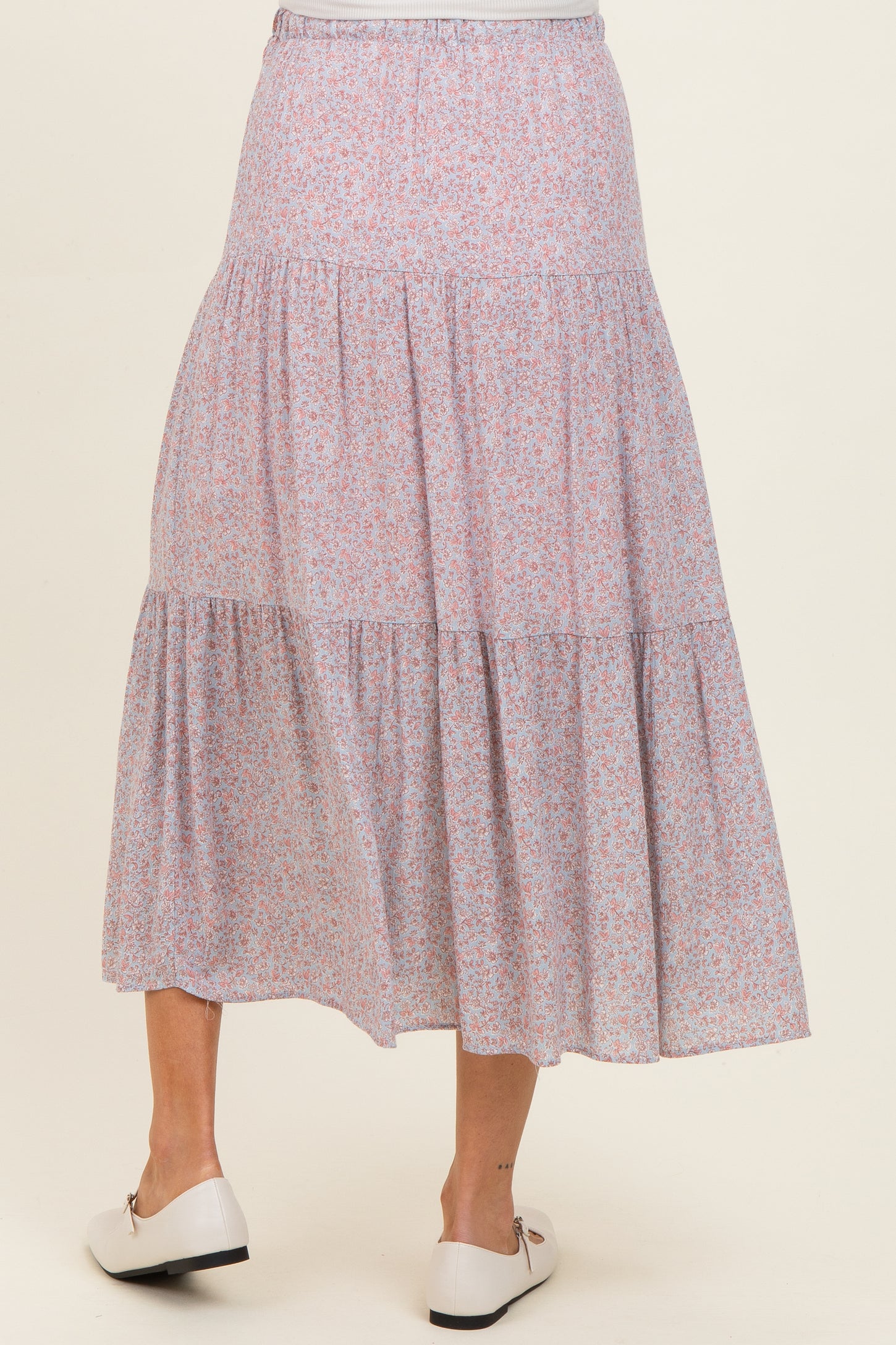 maternity wear floral tiered maxi skirt in pink and purple hues, model shown from the back