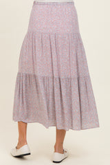 maternity wear floral tiered maxi skirt in pink and purple hues, model shown from the back