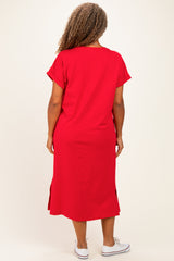 woman wearing a red plus size dress with short sleeves and side slits, viewed from the back