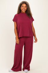 woman wearing a maroon ribbed knit plus size loungewear set with a short sleeve top and wide leg pants