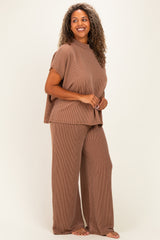 woman wearing a brown ribbed two-piece loungewear set with a short-sleeve top and wide-leg pants