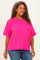 woman wearing a bright pink plus size ribbed t-shirt with short sleeves and a front pocket