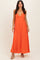 woman wearing a bright orange sleeveless maxi dress with a plunging neckline and a flowing silhouette