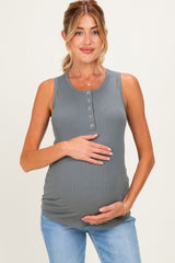 woman wearing a gray ribbed maternity tank top and holding her baby bump