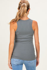 woman wearing a fitted gray maternity tank top, seen from the back, paired with light blue jeans