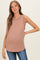 woman wearing a mauve ribbed maternity tank top with a scoop neckline and a baby bump visible