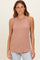 woman wearing a dusty rose ribbed sleeveless top with a round neckline and relaxed fit