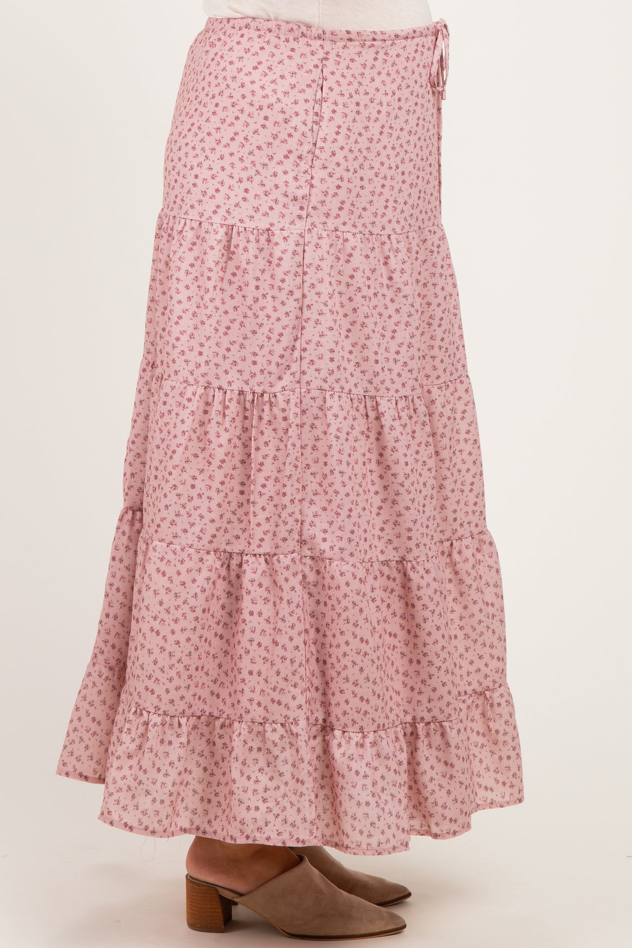 maternity wear pink floral tiered maxi skirt with ruffle hem and drawstring waist, model standing sideways