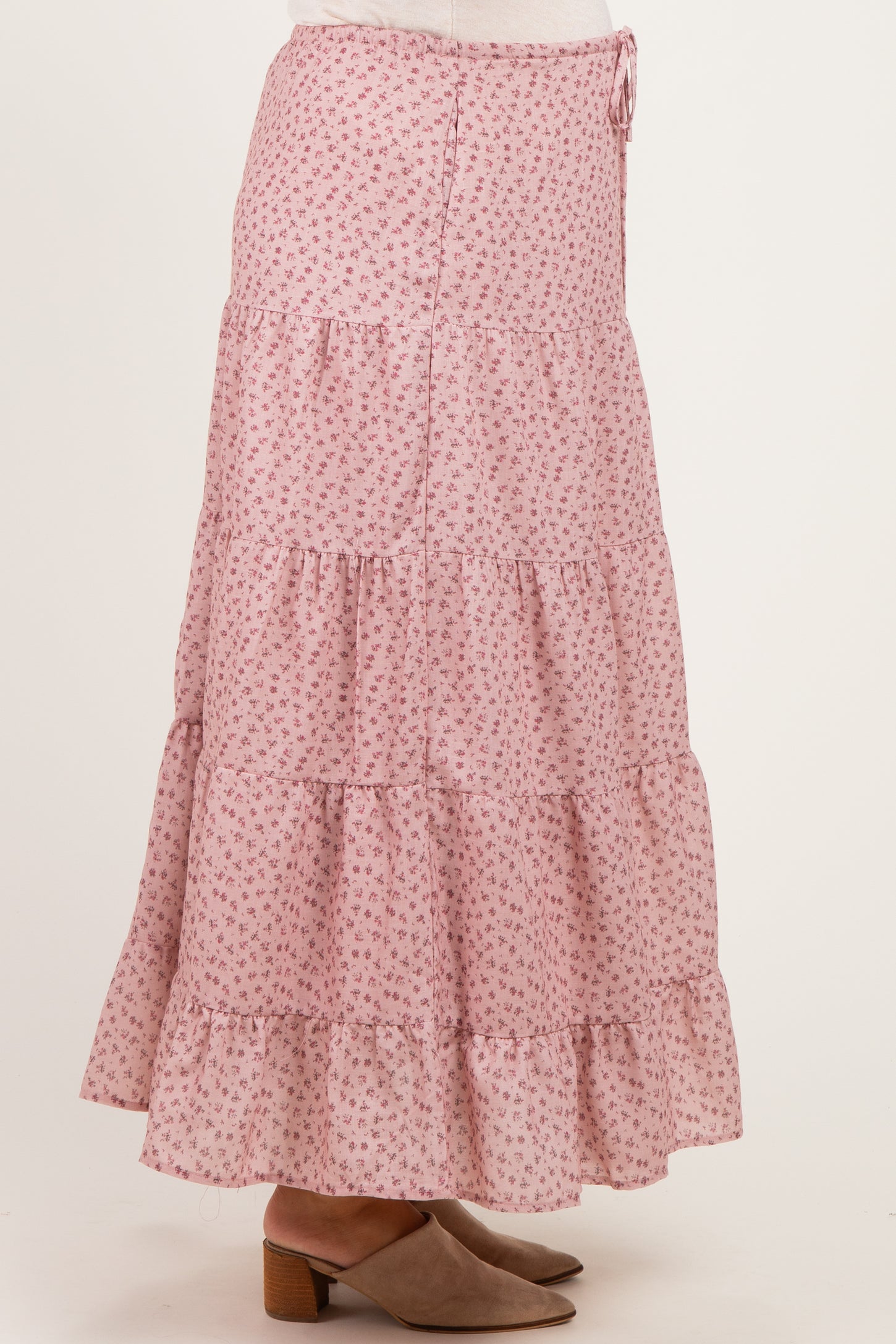 maternity wear pink floral tiered maxi skirt with ruffle hem and drawstring waist, model standing sideways