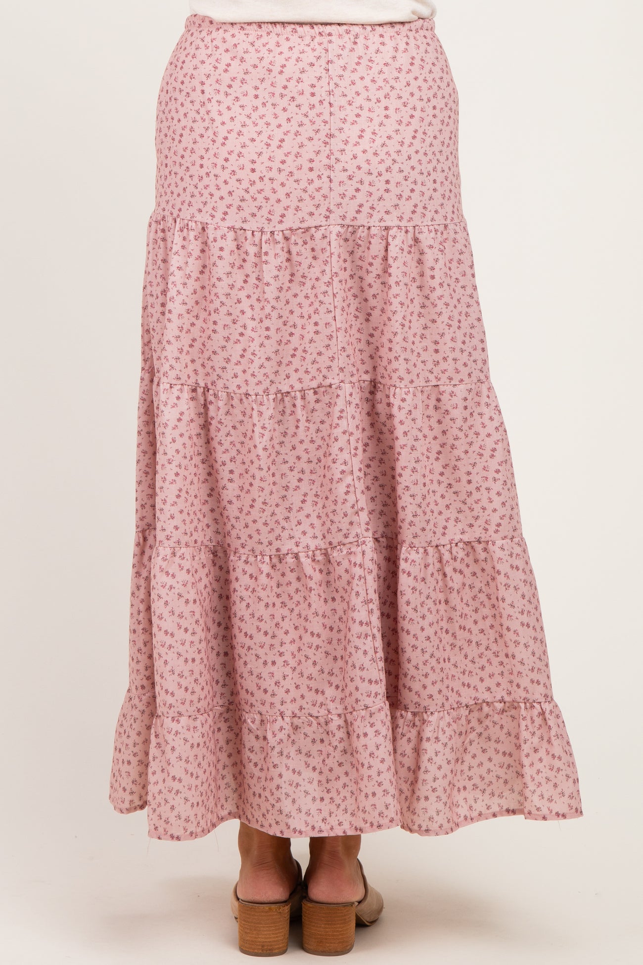 maternity wear pink tiered maxi skirt with small floral print, model shown from the back
