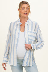 woman wearing a striped maternity button-up shirt with a front pocket and a visible baby bump