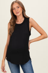 woman wearing a black ribbed maternity tank top displaying her baby bump with a relaxed fit and a round neckline