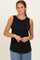 woman wearing a black ribbed sleeveless top with a round neckline and relaxed fit