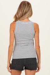 woman wearing a striped maternity tank top and black denim shorts, showing the back view