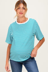 woman wearing a teal and white striped maternity t-shirt with a relaxed fit and a visible baby bump
