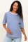 woman wearing a navy and white striped maternity t-shirt and holding her baby bump