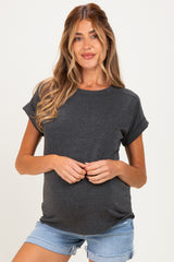 woman wearing a dark gray short sleeve maternity t-shirt and denim shorts, showing her baby bump