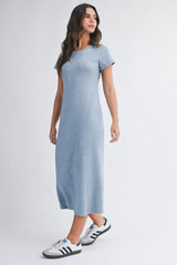 woman wearing a heather blue short sleeve maxi dress with a relaxed fit and standing against a light background