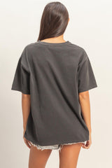 woman wearing an oversized dark gray t-shirt with a relaxed fit, viewed from the back