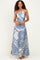 woman wearing a blue and white patterned maxi dress with spaghetti straps