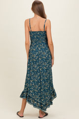 woman wearing a floral pattern maternity maxi dress with a ruffled hem and adjustable straps, seen from the back