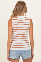 woman wearing a striped maternity tank top in white and orange, styled with denim shorts and showing her back