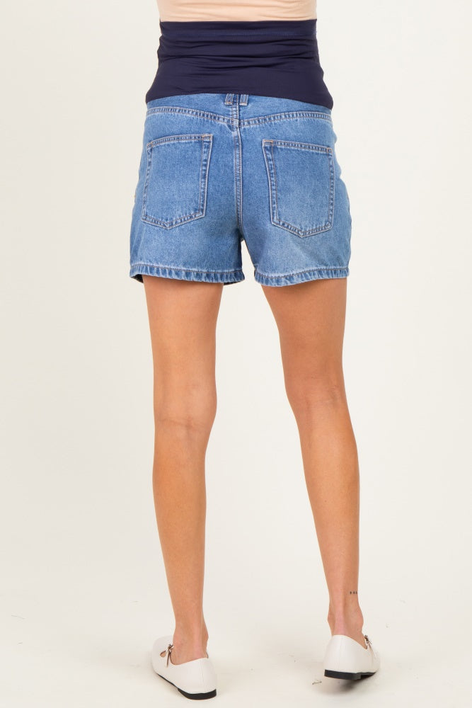woman wearing maternity denim shorts with a high waistband, showing a comfortable fit from the back