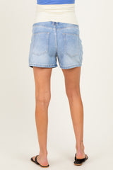 woman wearing light blue maternity denim shorts, showing the back view