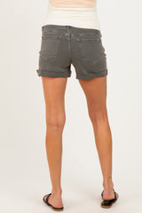 woman wearing gray maternity denim shorts, showing the back view with a relaxed fit and rolled hem