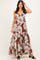 woman wearing a brown floral maxi dress with a tiered skirt and adjustable straps