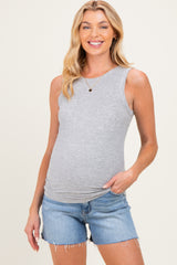 woman wearing a grey ribbed maternity tank top and denim shorts, showing her baby bump