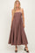 woman wearing a brown strapless maxi dress with a fitted bodice and full skirt