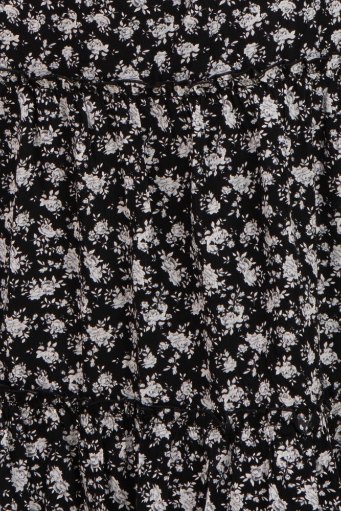 black floral maternity dress with gathered tiers and a fitted bodice