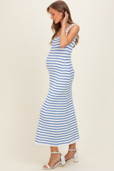woman wearing a blue and white striped sleeveless maternity maxi dress showcasing her baby bump