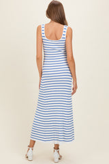 woman wearing a blue and white striped maternity maxi dress with a fitted silhouette and scoop back