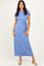 woman wearing a light blue maxi dress with short sleeves and a side tie detail