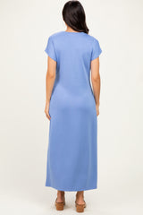 woman wearing a light blue short sleeve maxi dress with a relaxed fit, shown from the back