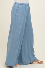 woman wearing light blue wide-leg pants with an elastic waistband and side pockets