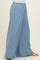 woman wearing light blue wide-leg pants with an elastic waistband and side pockets