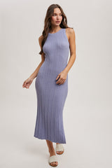 woman wearing a light purple ribbed knit maxi dress with a high neckline and a fitted silhouette