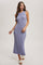 woman wearing a light purple ribbed knit maxi dress with a high neckline and a fitted silhouette