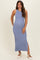 woman wearing a ribbed light blue maternity maxi dress with a side slit and a visible baby bump