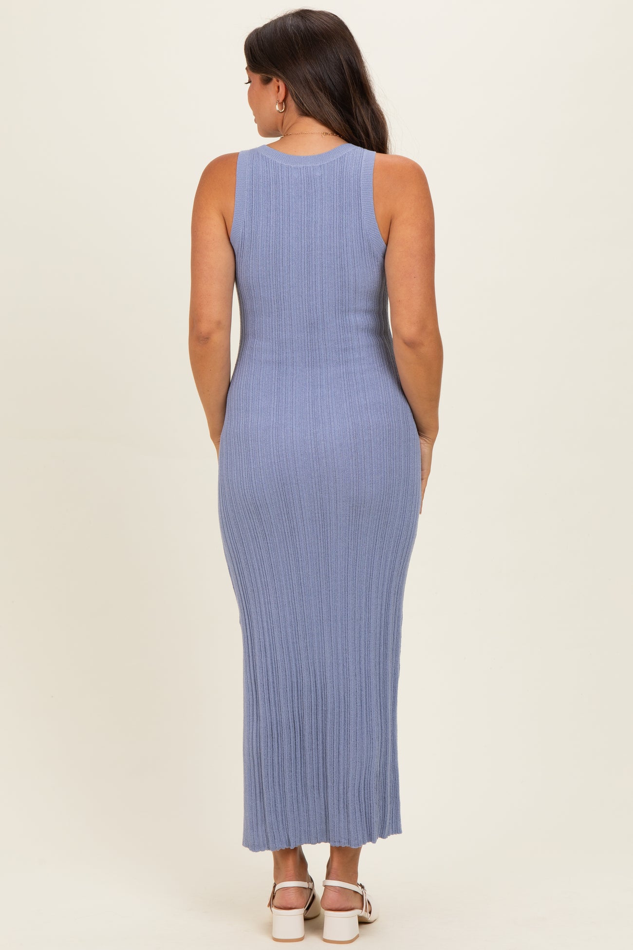 woman wearing a light blue ribbed maternity maxi dress, showing the back view